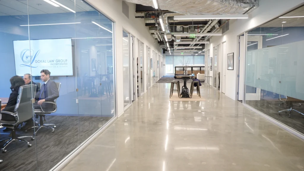 An image of the hallway in Gokal Law Group’s office and the team in a conference room where they’re discussing a case that revolves around the question, Can a power of attorney change a will in California?
